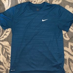 Blue Nike athletic shirt